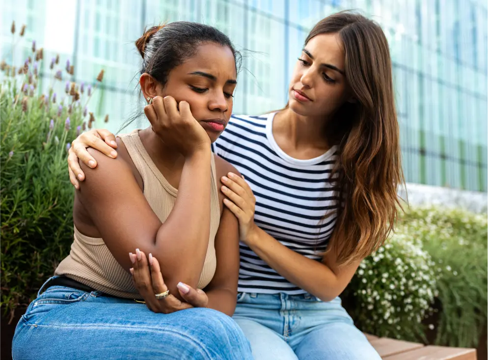 woman consoling a young girl