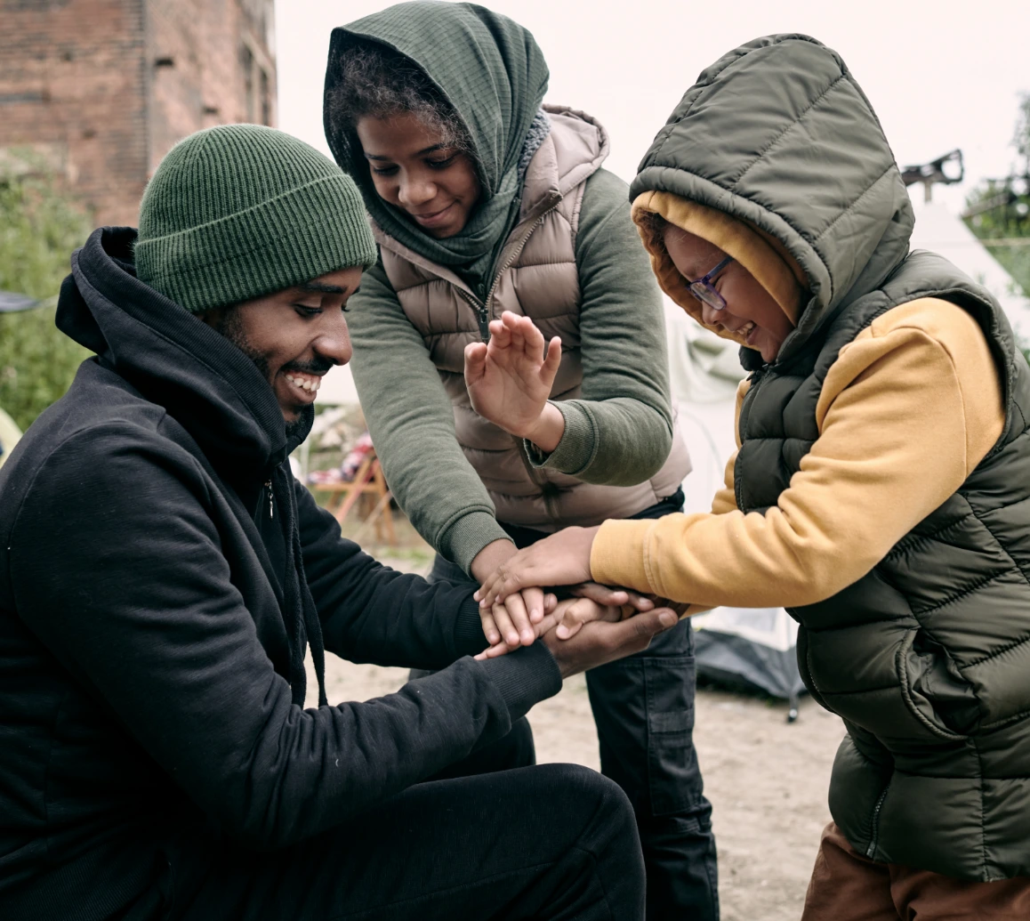 man playing with two little boys