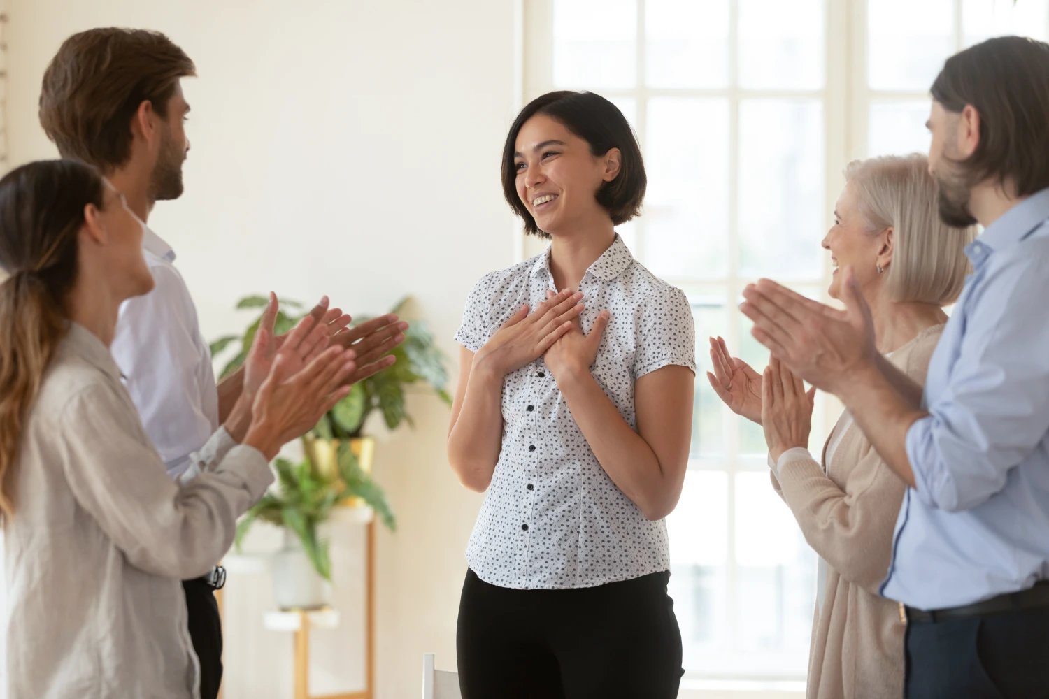 woman accepting praises from the people